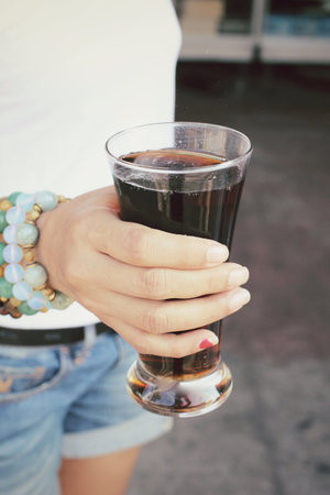 Woman drinking a cola