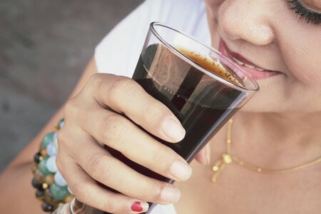 Woman drinking a colaの写真素材