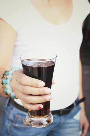 Woman drinking a colaの写真素材