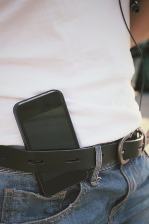 Smart phone with jeansの写真素材