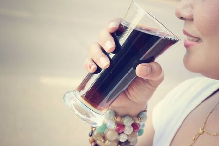 Woman drinking a colaの写真素材