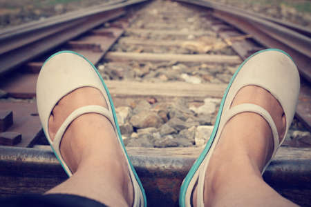 Selfie of railroad with shoesの写真素材