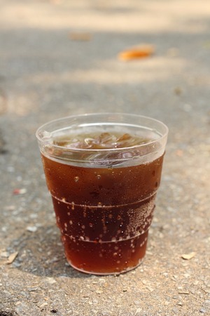 Glass of cola with ice cubesの写真素材