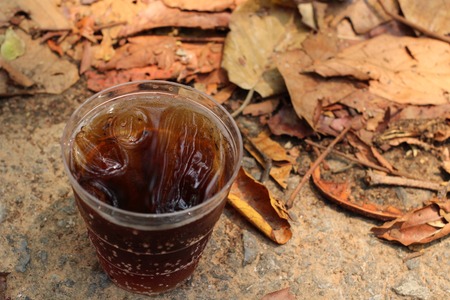 Glass of cola with ice cubesの写真素材