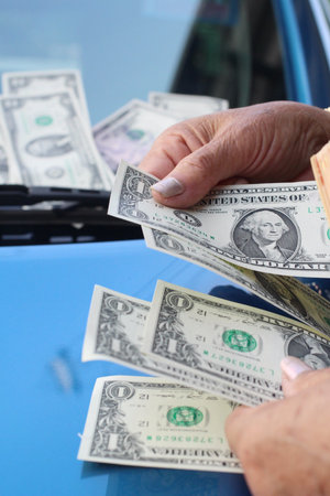 Dollars with car