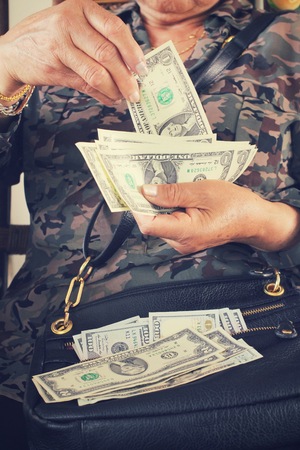 Dollars with handsの写真素材