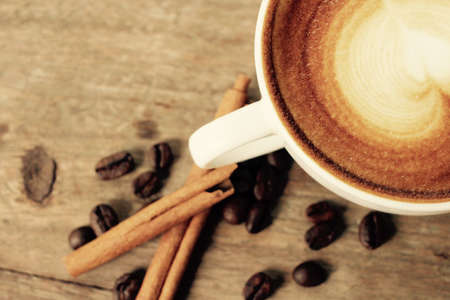 Vintage latte art coffee with cinnamonの写真素材