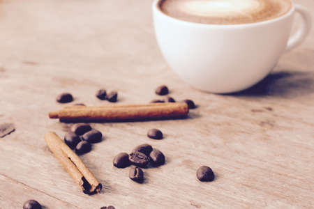 Vintage latte art coffee with cinnamonの写真素材