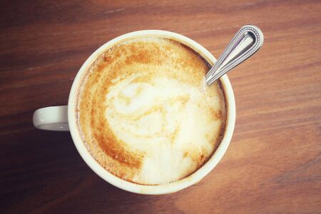 Vintage latte art coffeeの写真素材