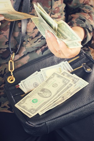 Dollars with handsの写真素材