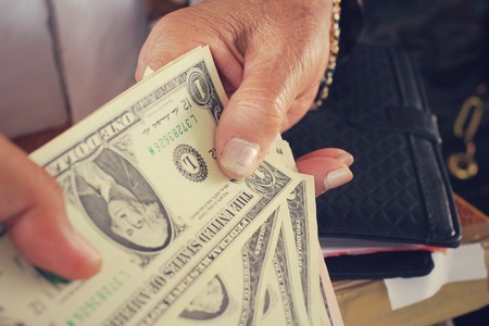 Dollars with handsの写真素材