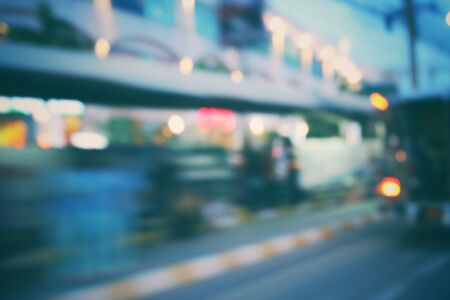 Blurred of car in city at nightの写真素材