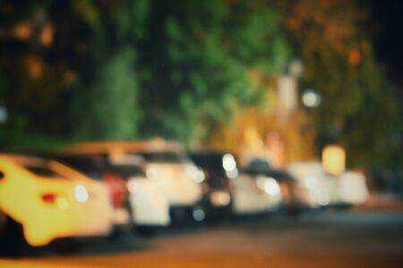 Blurred of car in city at nightの写真素材