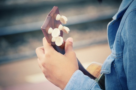Woman playing ukuleleの写真素材