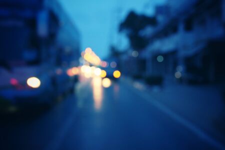 Blurred of car in city at nightの写真素材