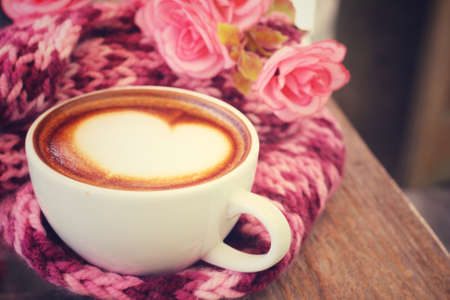 Vintage latte art coffee with scarfの写真素材