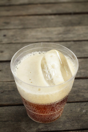 Glass of cola with ice cubes