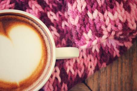 Vintage latte art coffee with scarfの写真素材