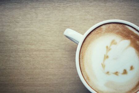 Vintage latte art coffeeの写真素材