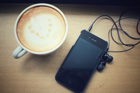 Coffee with smartphoneの写真素材