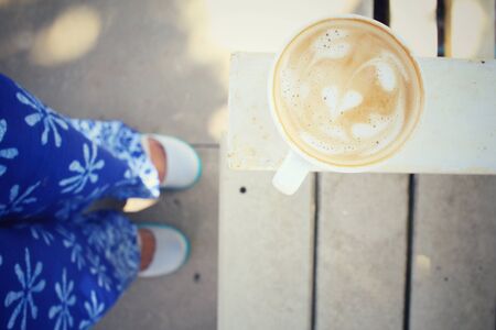 Selfie of coffee with shoesの写真素材