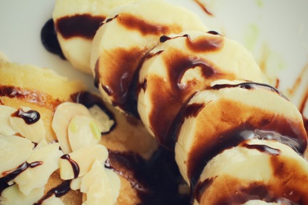 Banana with chocolate sauceの写真素材