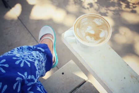 Selfie of coffee with shoesの写真素材