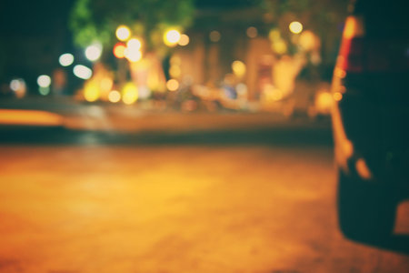 Blurred of car in city at nightの写真素材