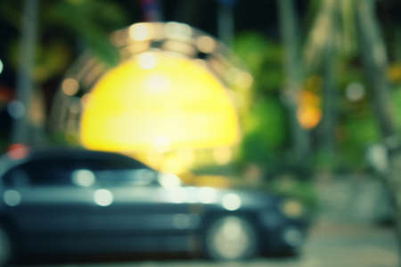 Blurred of car in city at nightの写真素材
