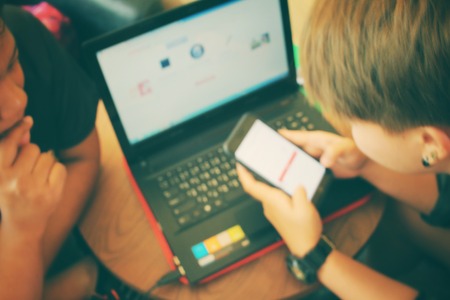 Blurred of playing on computer notebookの写真素材