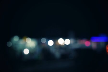 Blurred of car in city at nightの写真素材