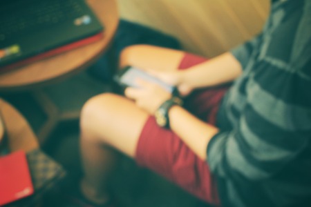 Blurred of using smart phoneの写真素材