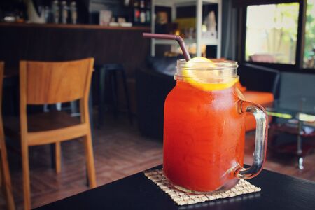 Ice tea with lemon on a jarの写真素材