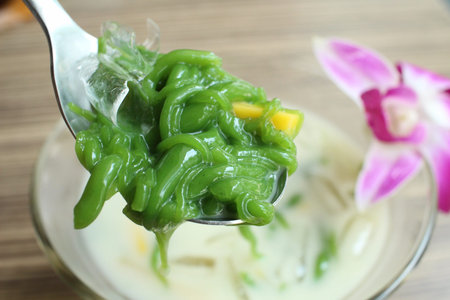 Dessert of green noodle with coconut milk