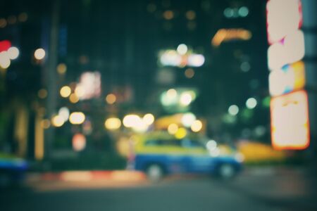 Blurred of car in city at nightの写真素材