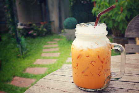 Ice oolong tea and milk on a jarの写真素材