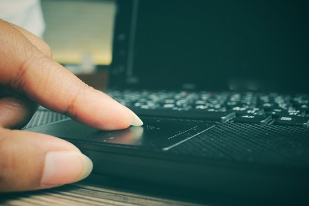 Woman playing on computer notebookの写真素材
