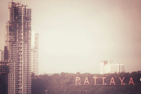Crane and unfinished building at pataya