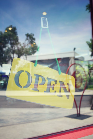 Open signboard with shadow