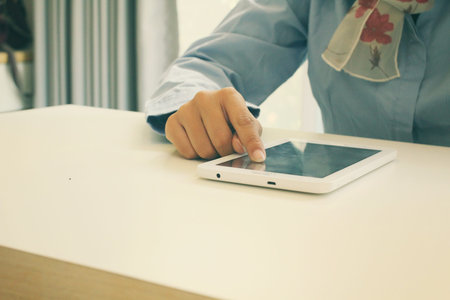 Businesswoman using tablet in the cafeの写真素材