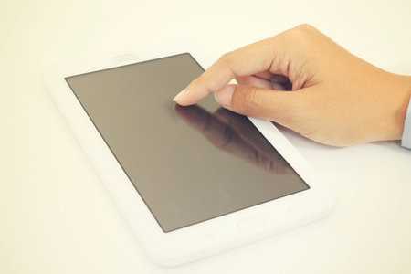 Businesswoman using tablet in the cafeの写真素材