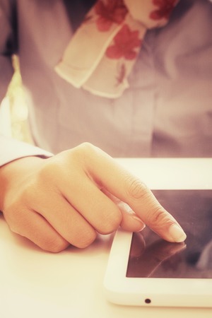 Businesswoman using tablet in the cafeの写真素材