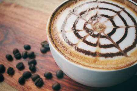 Vintage latte art coffeeの写真素材