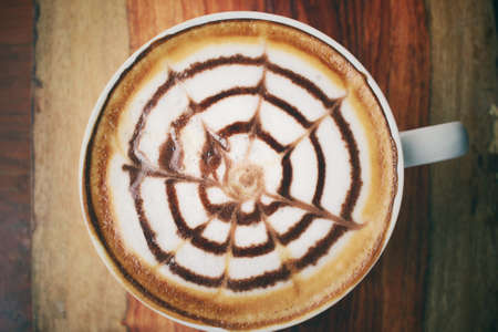 Vintage latte art coffeeの写真素材