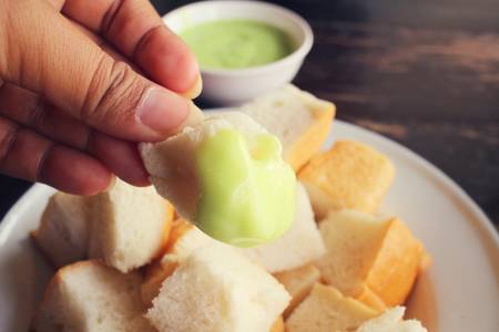 Bread with green tea jamの写真素材