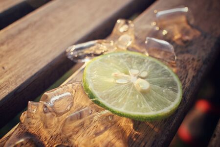 Slice of lemon with iceの写真素材