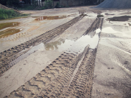 Wheel tracks on the soil.