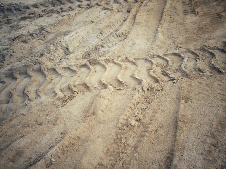 Wheel tracks on the soil.