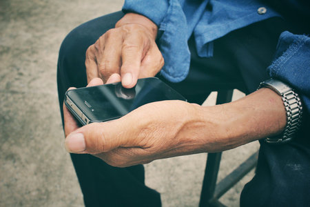 Senior man using smart phone