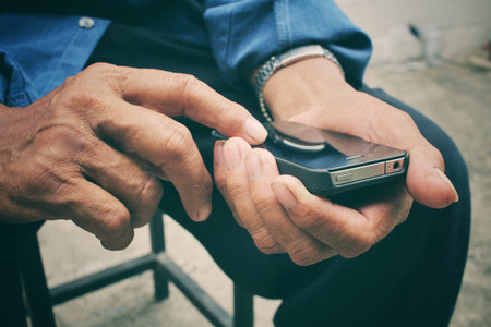 Senior man using smart phone